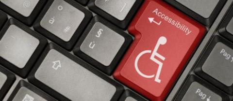 imagen de un teclado con una tecla con el símbolo de la discapacidad